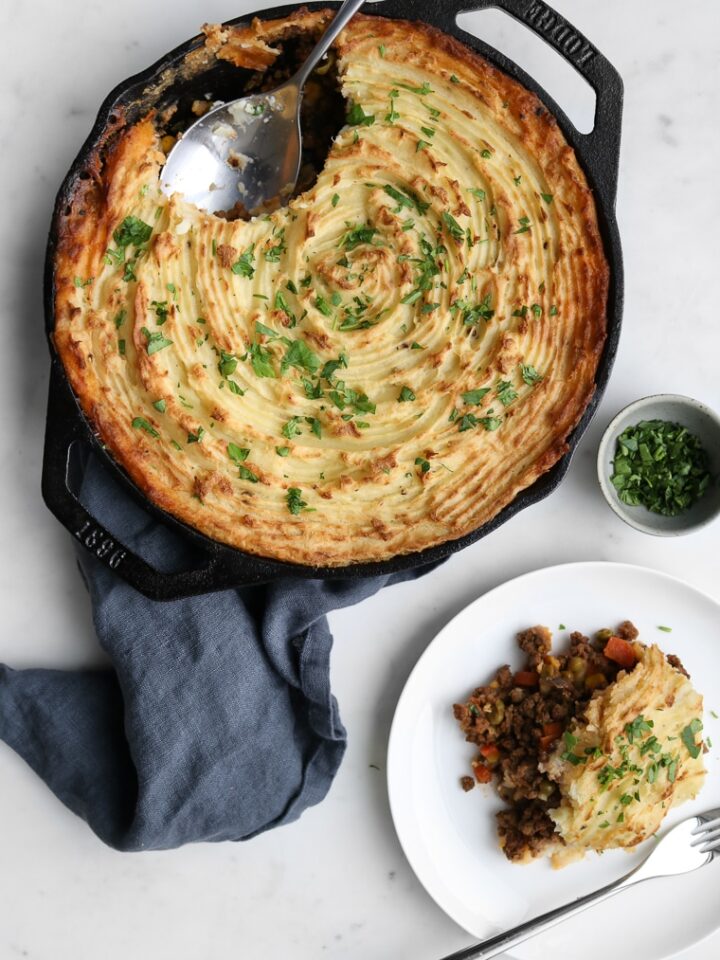 Traditional Cottage Pie in a Cast Iron Skillet on a Napkin