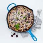 Cherry Clafoutis in a blue skillet