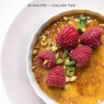 Close up of dairy-free creme brulee with raspberries and pistachios on top