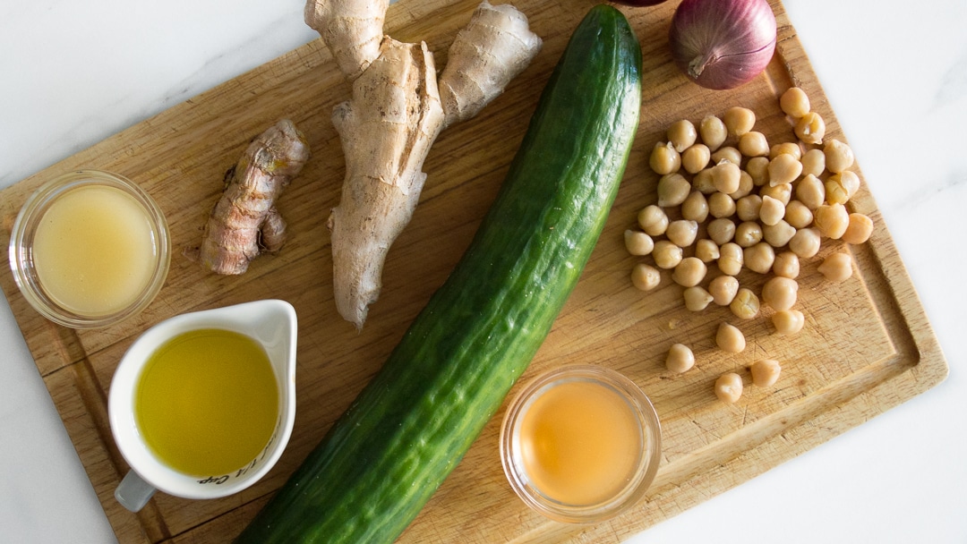 Cucumber Chickpea Salad Ingredients on a Cutting Board