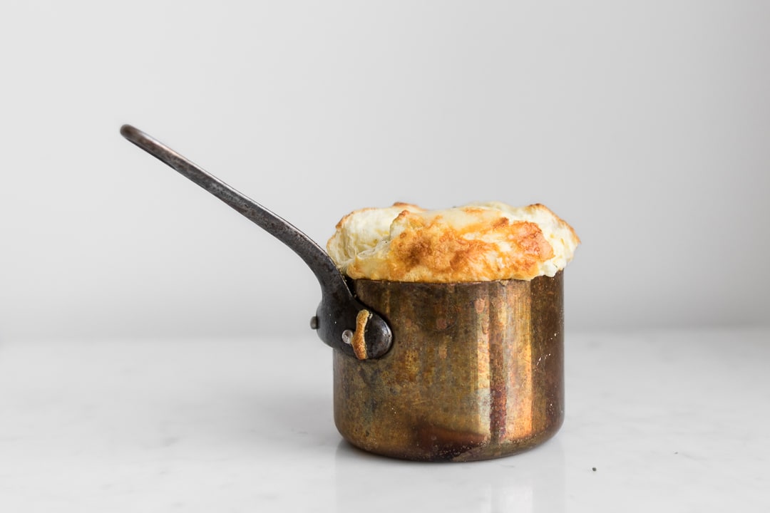 Cheese souffle cooked in a copper pot