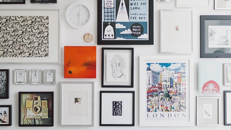 Wall of Photos and Art in Frames Arranged in Gallery Style