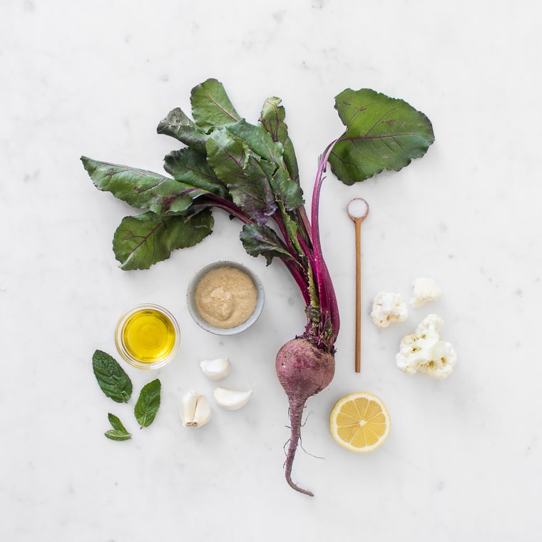 Flat lay image of ingredients for roasted cauliflower and beet hummus