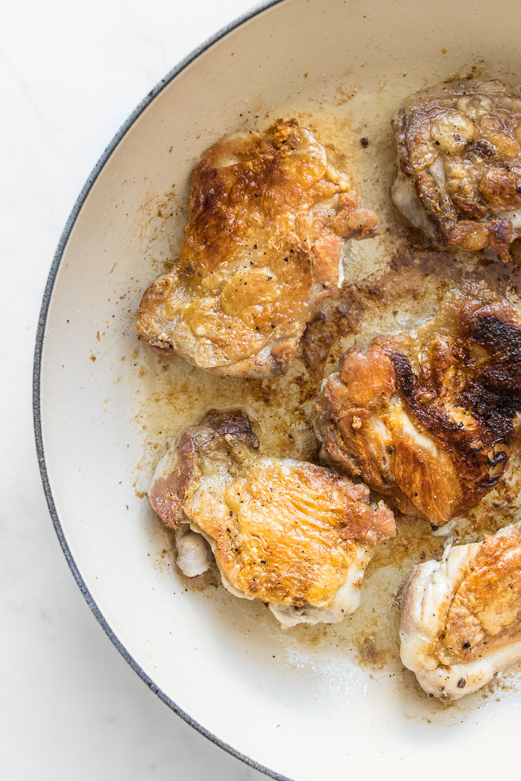 Chicken frying in a dutch oven