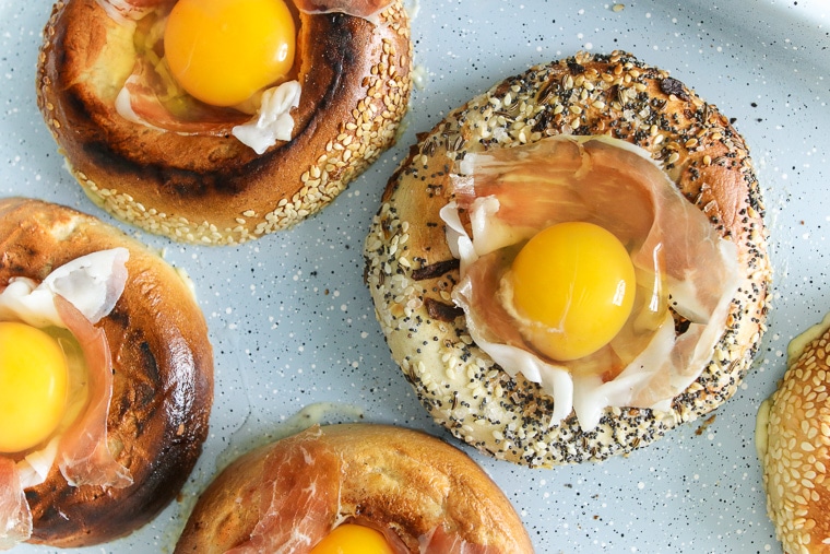 Close up of eggs in a bagel hole before being baked