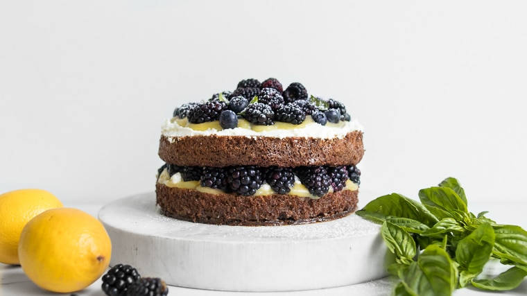 Two layer lemon almond cake with lemon curd and berries.