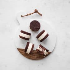 Coconut Ice Cream Sandwiches on a marble and wooden board