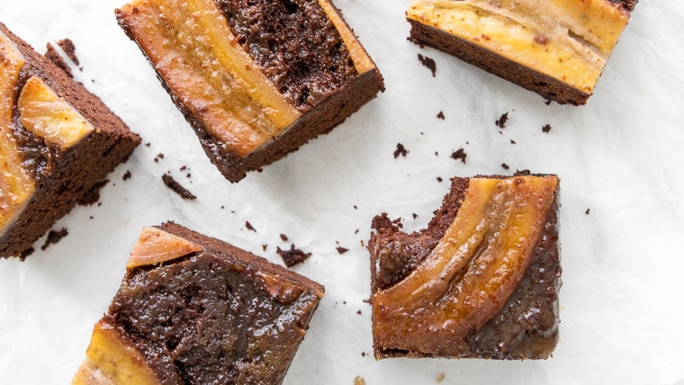 Caramelized Banana Upside Down Cake cut in squares and a bite taken from one