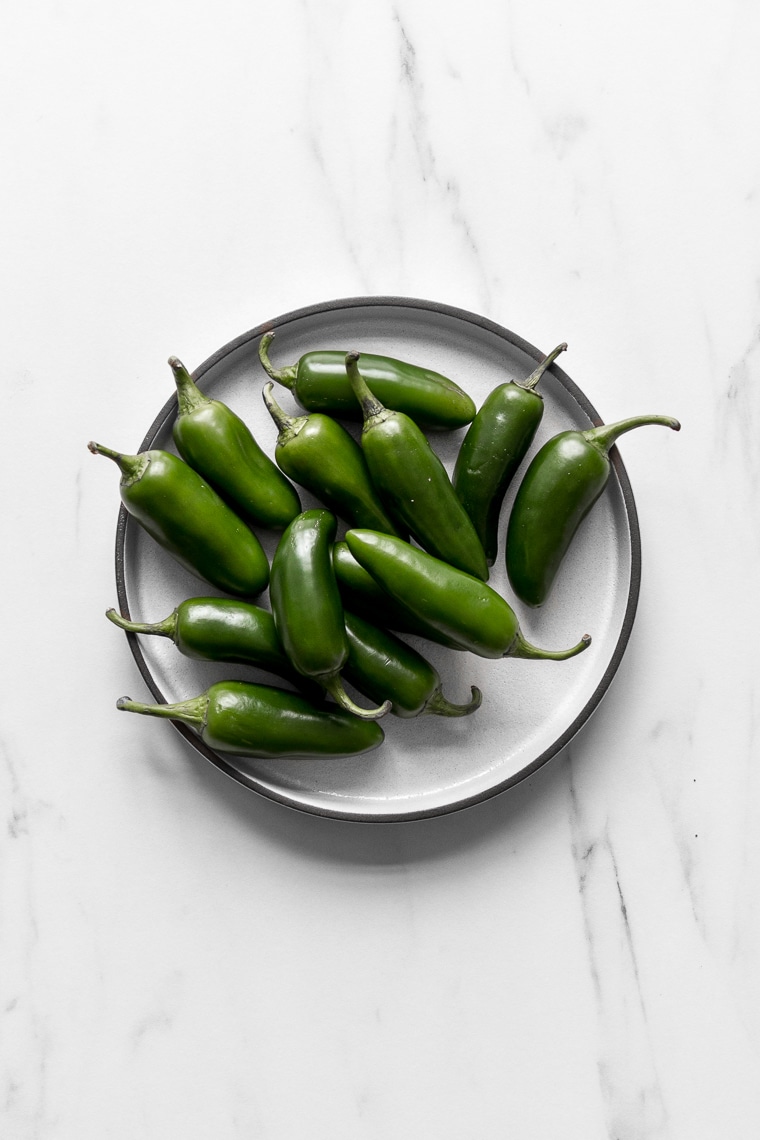 Plate filled with jalapeno peppers