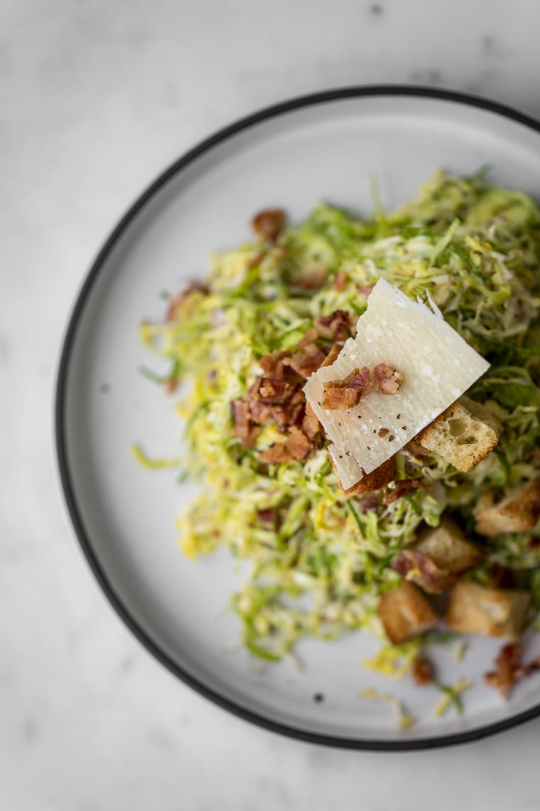 Overhead shot of the plated Brussels Sprout Caesar Salad