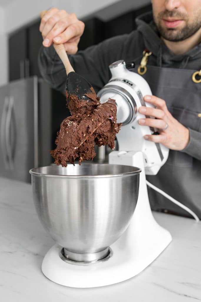 Scraping chocolate cookie dough from kitchen aid mixer