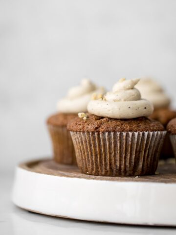 Close up of carrot cake muffin with brown butter frosting