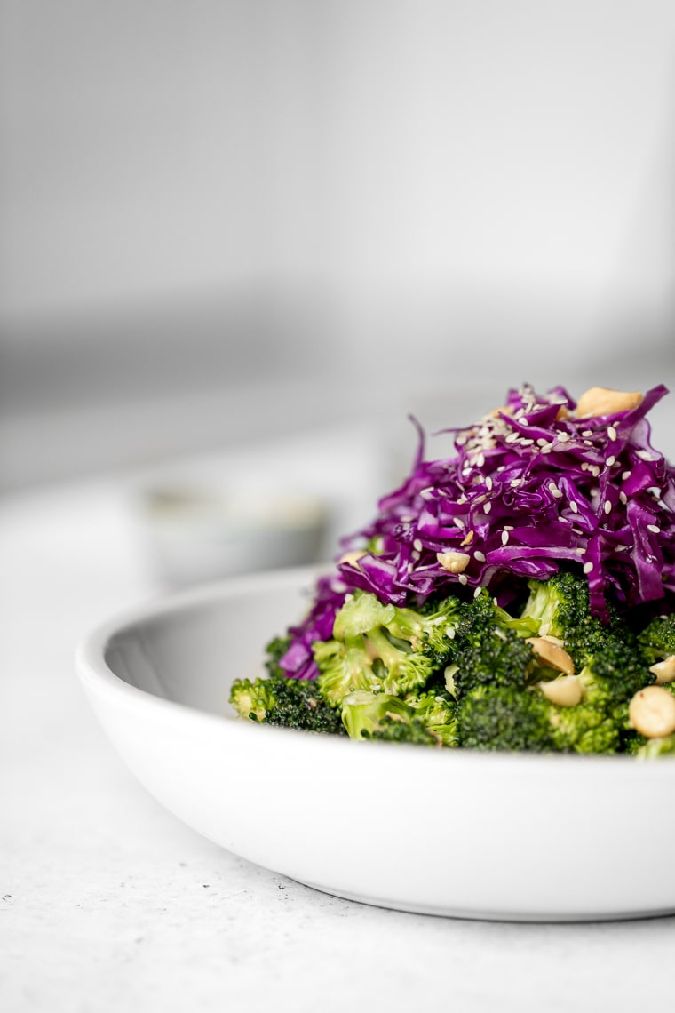 Close up of Raw Broccoli Salad wth Red Cabbage on Top