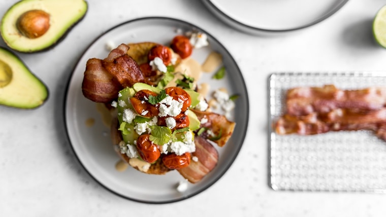 Savoury French Toast with cut avocado and bacon on a cooling rack