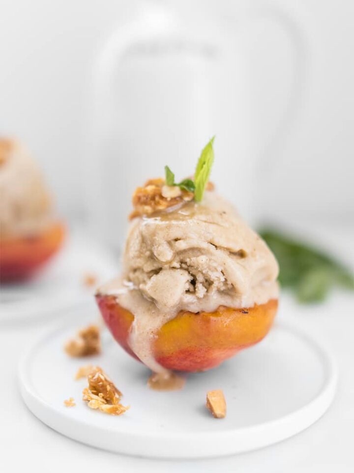 Close Up of No-Churn Ice Cream on Grilled Peach with Candied Nuts