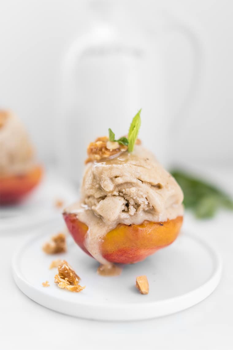 Close Up of No-Churn Ice Cream on Grilled Peach with Candied Nuts