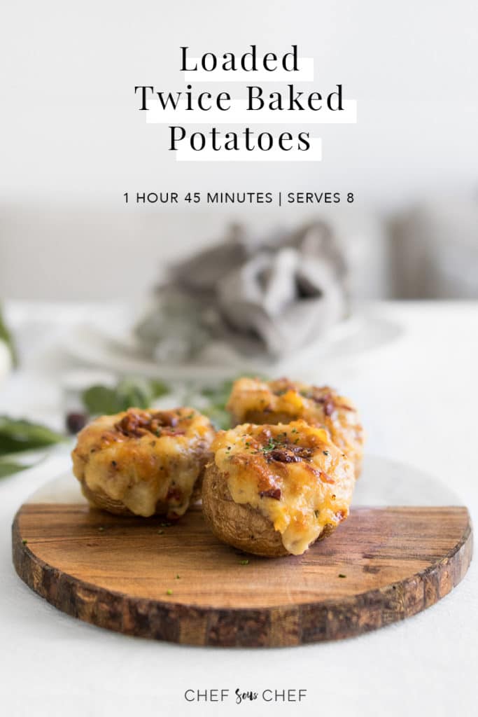 Loaded Twice Baked Potatoes on a board with text overlay