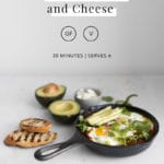 Vegetarian Shakshuka on a marble table with toast and avocado with recipe title