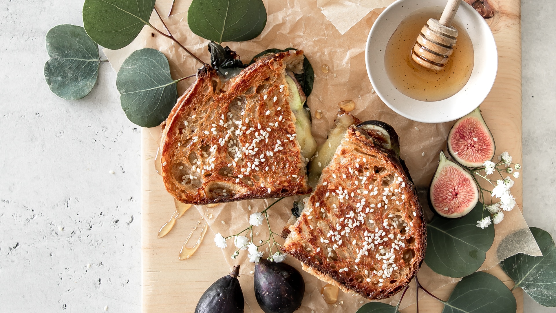 Gourmet grilled cheese sandwich with figs and honey