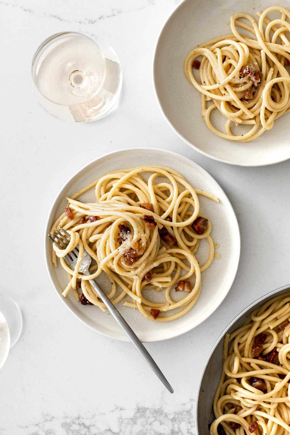Spaghetti Carbonara on Plates with White Wine