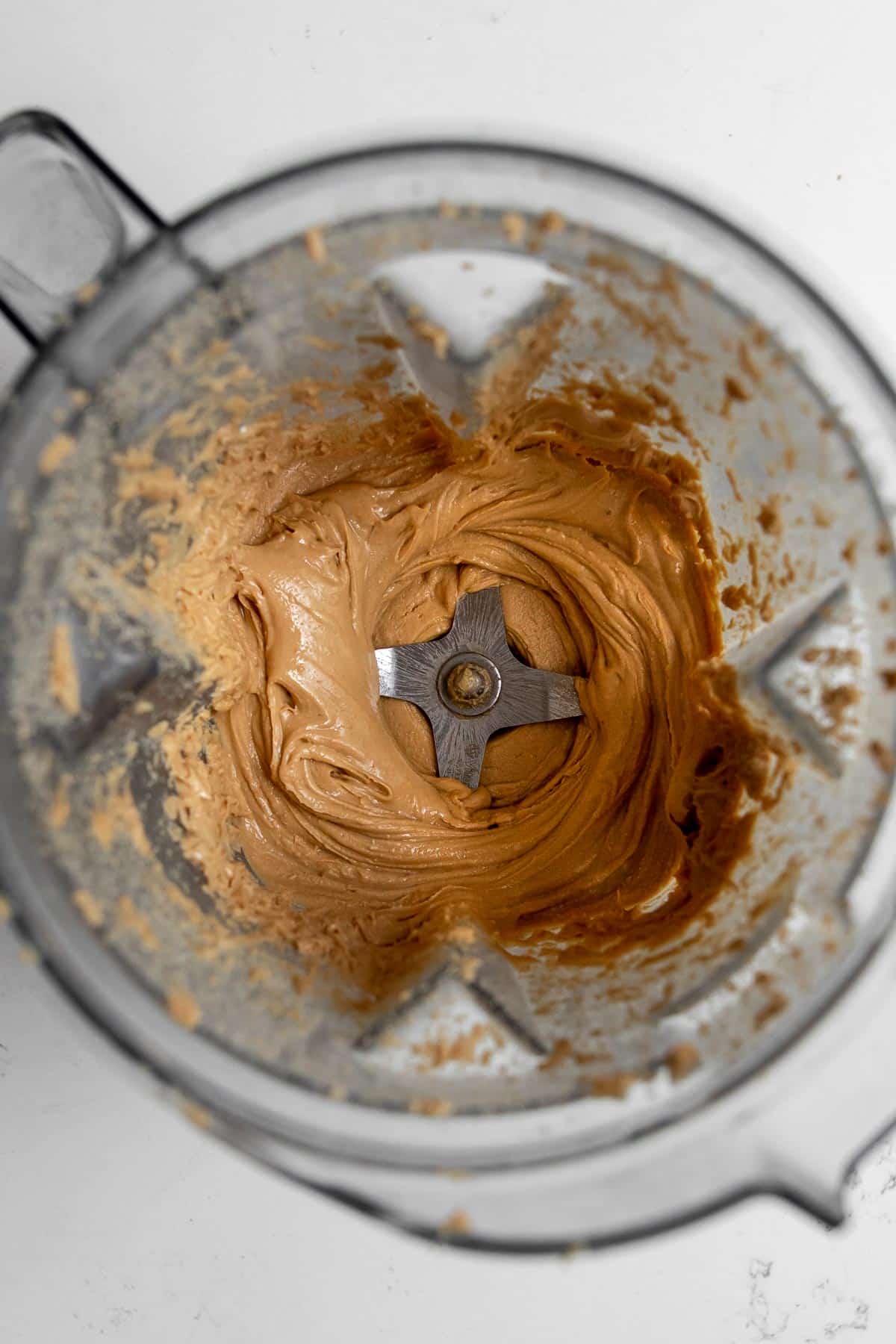 Overhead close-up of creamy homemade cashew butter in a Vitamix.