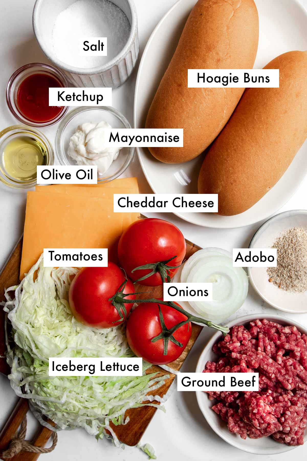 Ingredients to make a New York style chopped cheese sandwich laid on a table.
