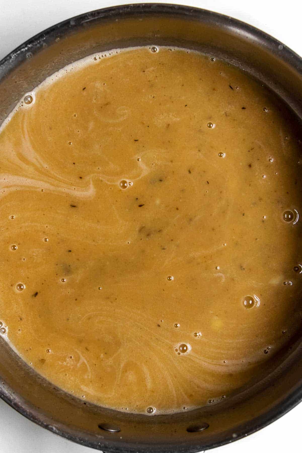 emulsified butter with pasta water in a pan.