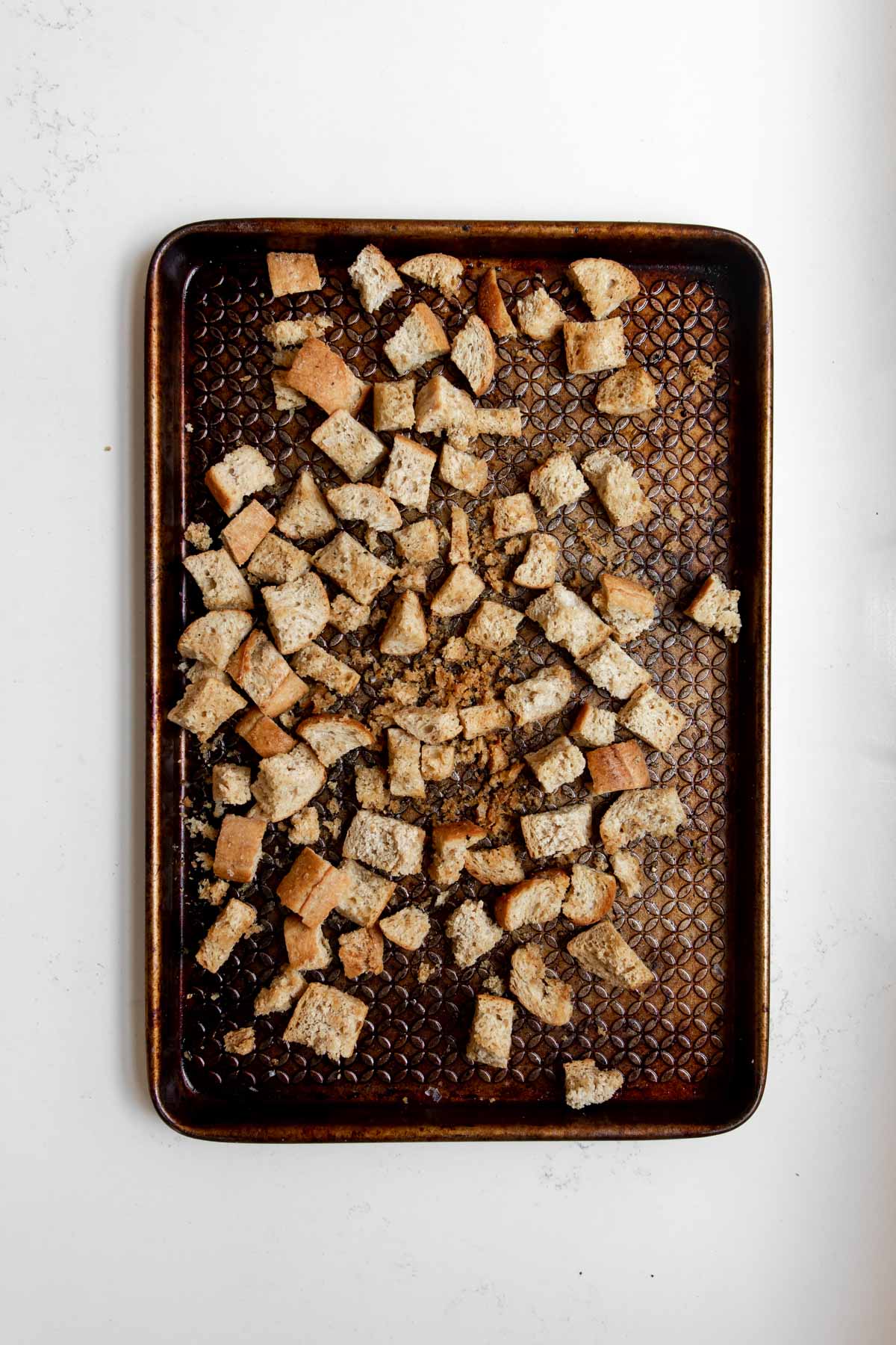 roasted croutons arranged on a baking sheet.