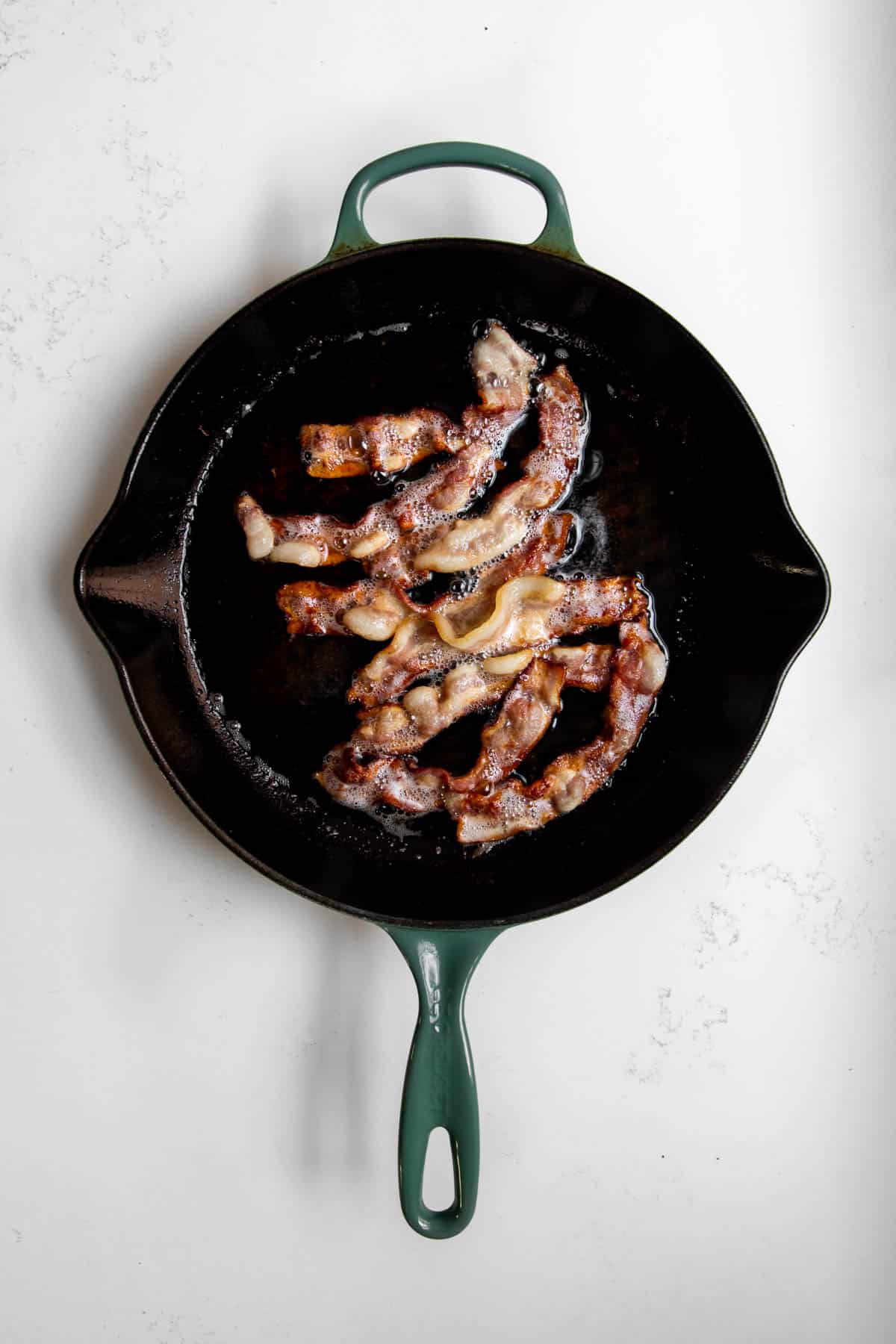 crispy bacon in a cast iron skillet.