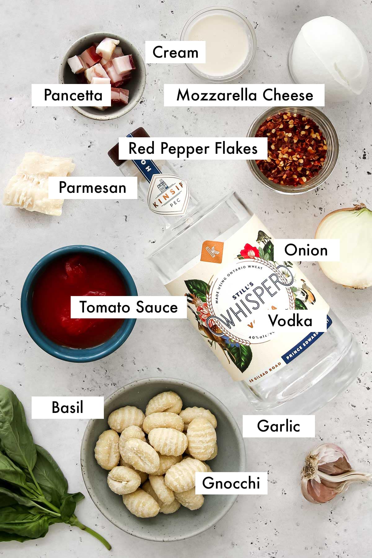 ingredients to make gnocchi with vodka sauce with text graphic.