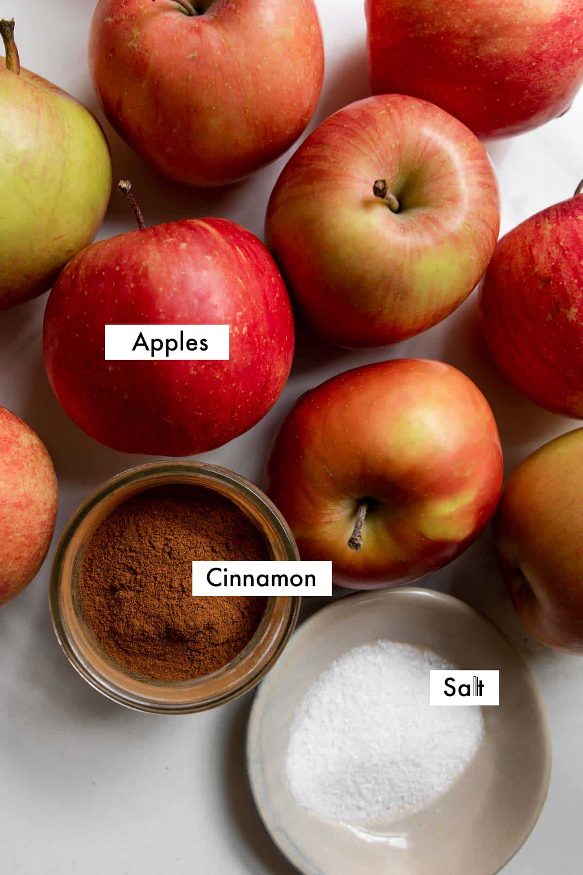 ingredients needed to make cinnamon applesauce with text graphics.