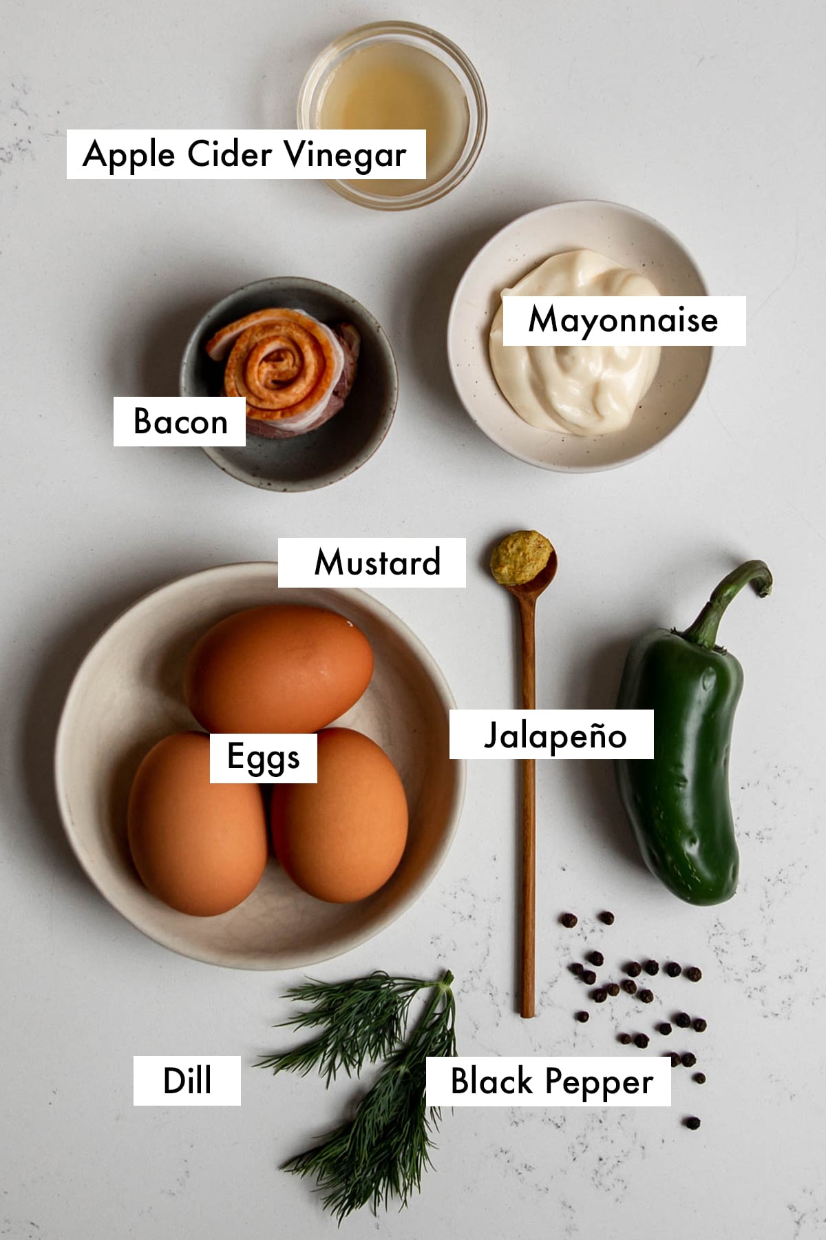 ingredients for spicy deviled eggs labelled with text graphics.