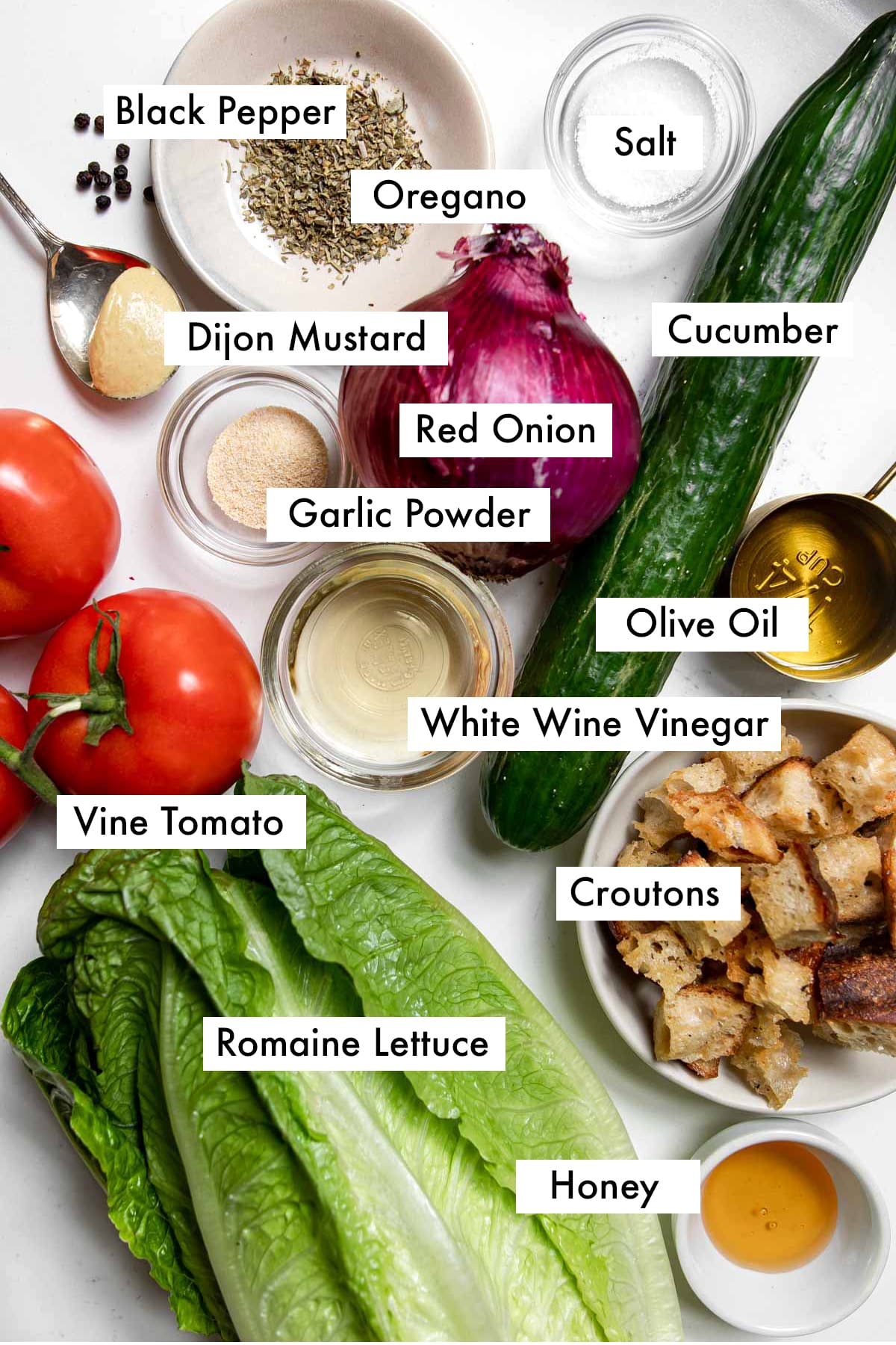 ingredients to make house salad with honey dijon vinaigrette with text graphics.