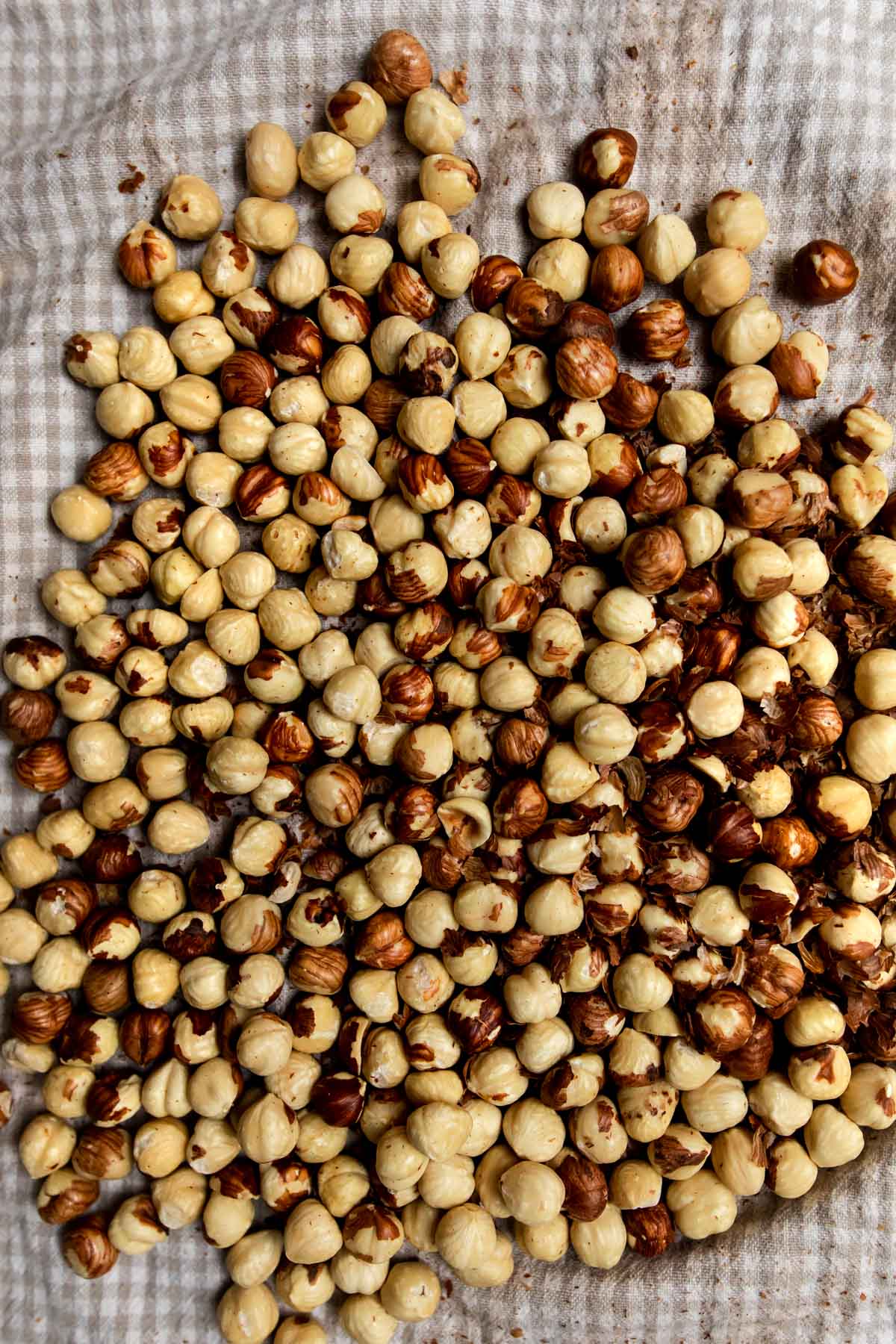 roasted hazelnuts in a tea towel with skins removed.