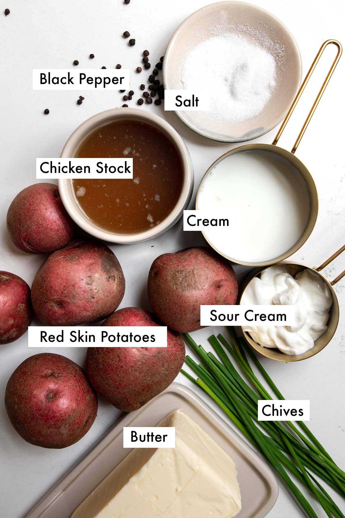 ingredients needed to make creamy ed skin mashed potatoes with text graphics.