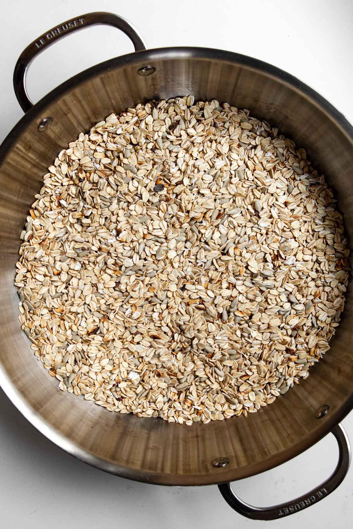 toasted oats and sunflower seeds in a skillet.