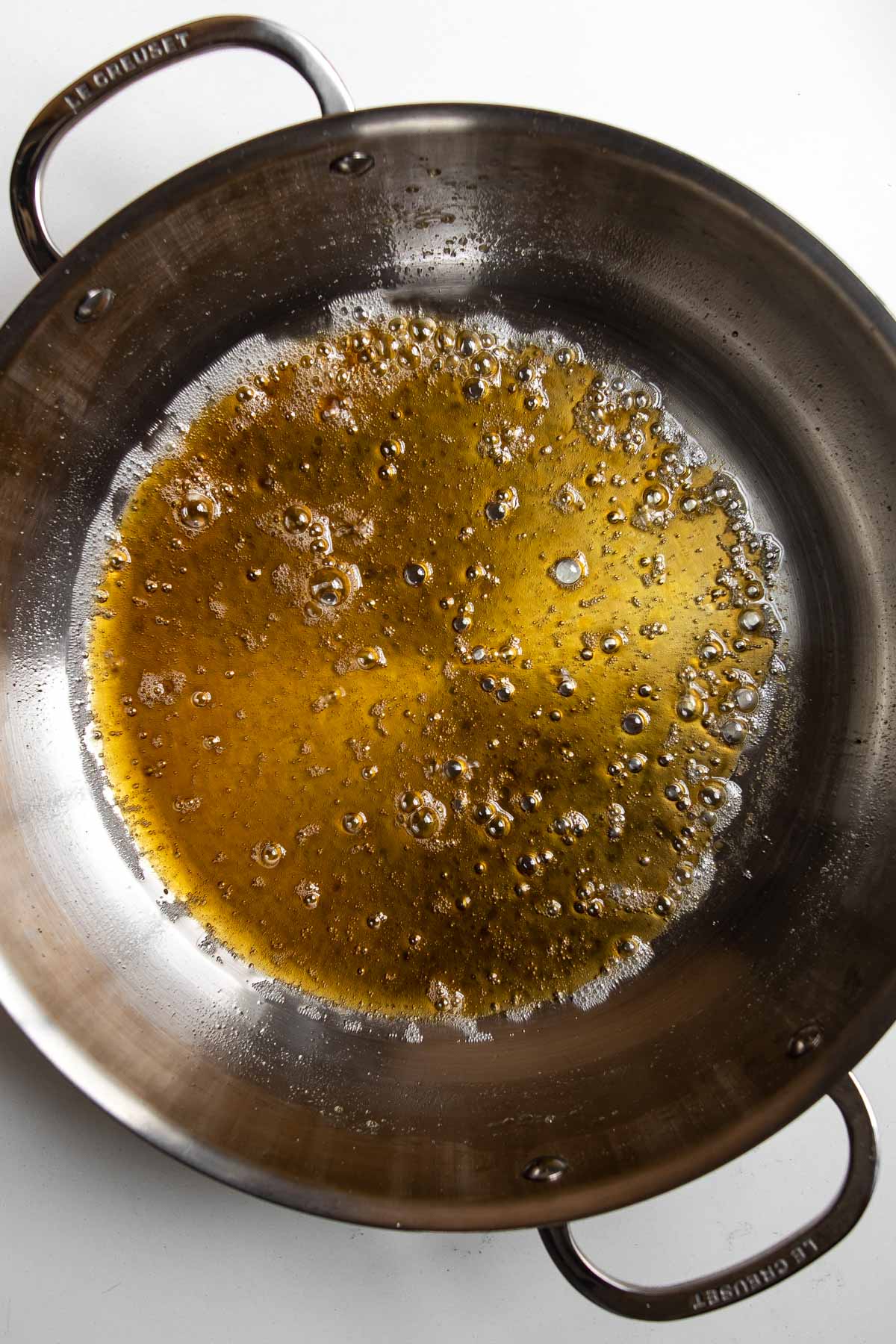 maple syrup boiling in a skillet.