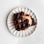 brownie waffle ice cream sandwich with chocolate ice cream on a plate.